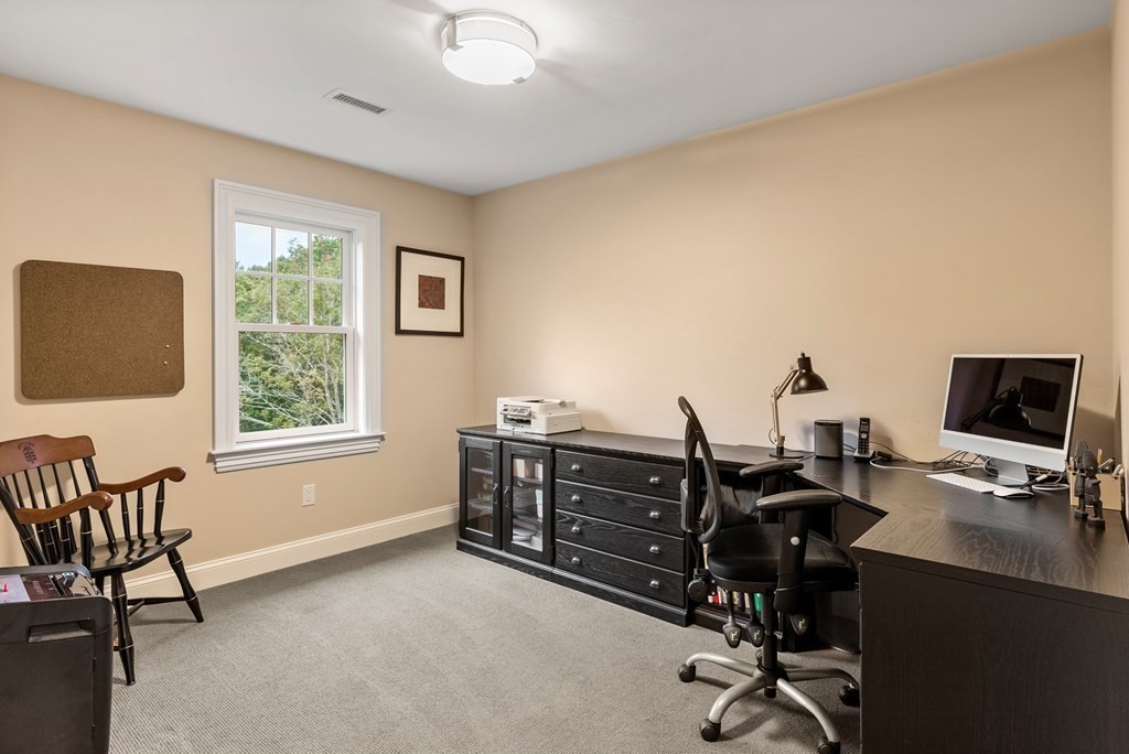 4 Fields Lane Wayland, MA 01778 - Photo 24 of 39 a view of a workspace with furniture and a window