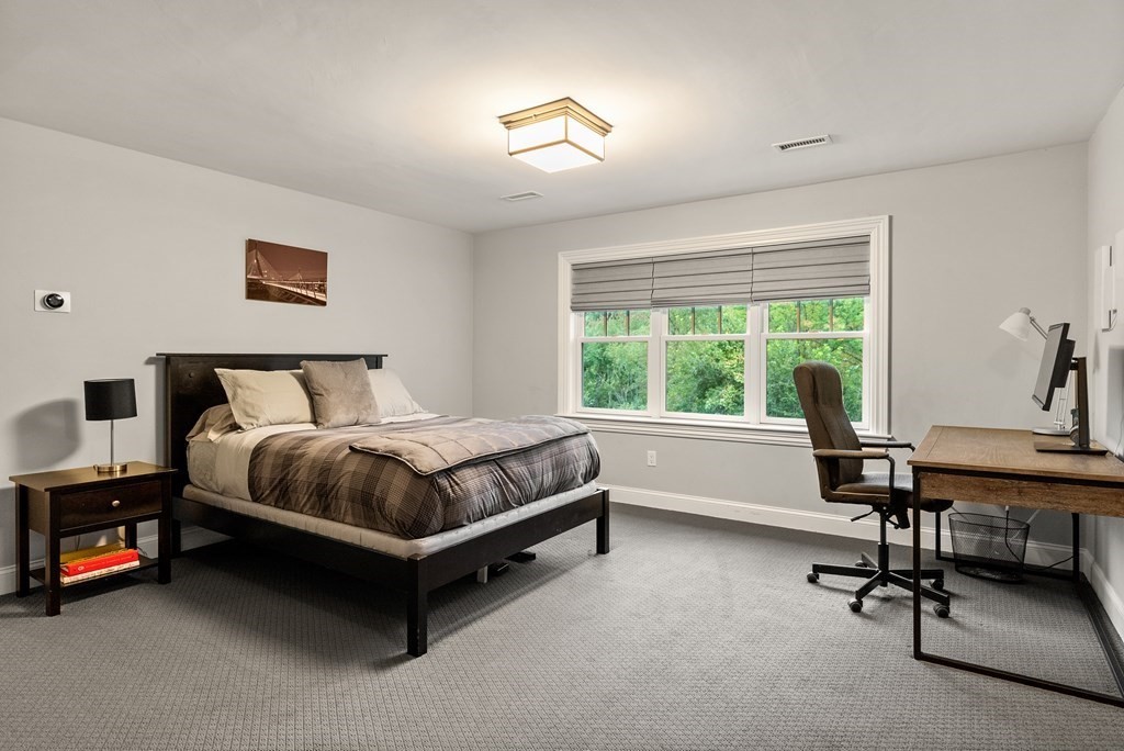 4 Fields Lane Wayland, MA 01778 - Photo 25 of 39 a bedroom with a bed and a desk