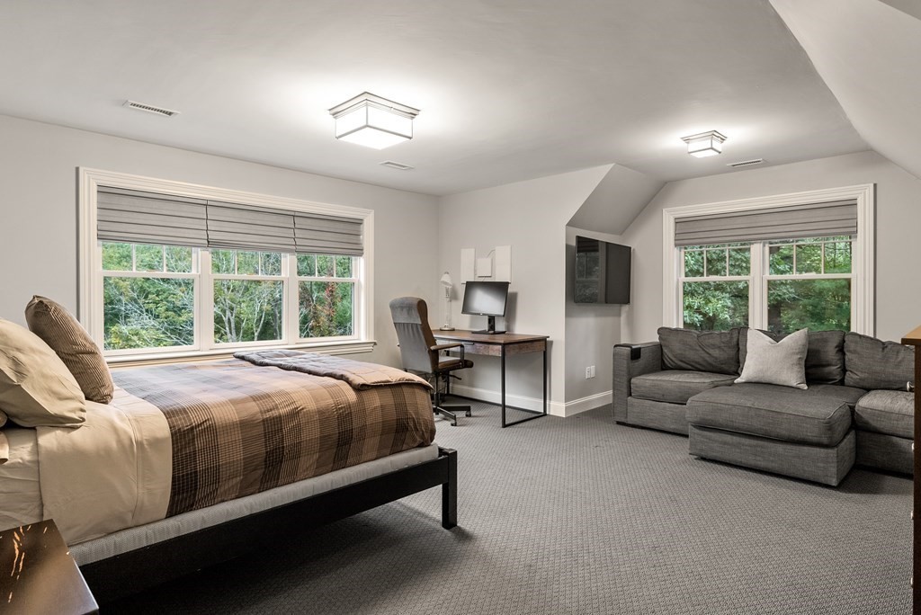 4 Fields Lane Wayland, MA 01778 - Photo 26 of 39 a bed room with a bed and a couch