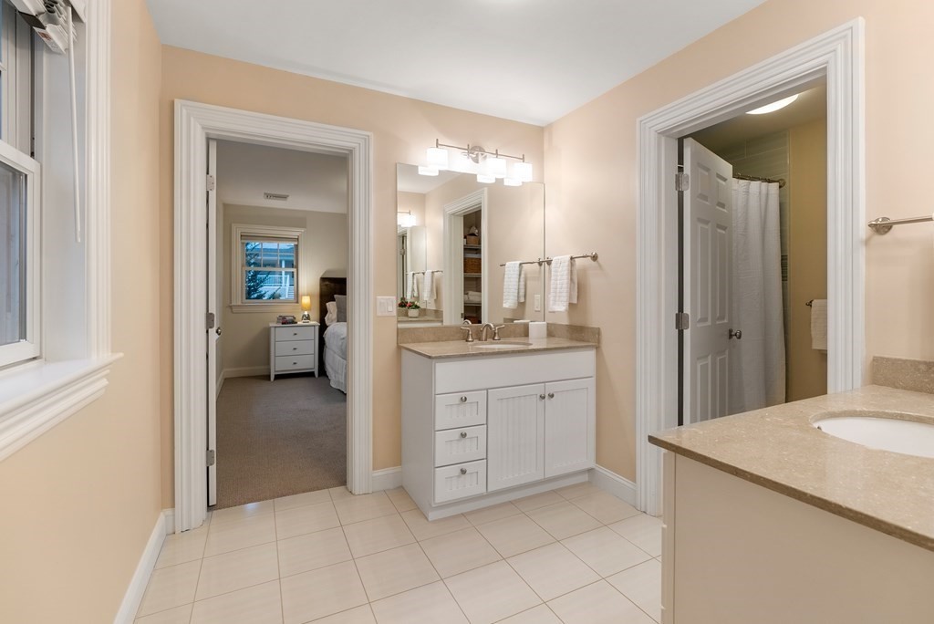 4 Fields Lane Wayland, MA 01778 - Photo 29 of 39 a spacious bathroom with a granite countertop sink mirror and a