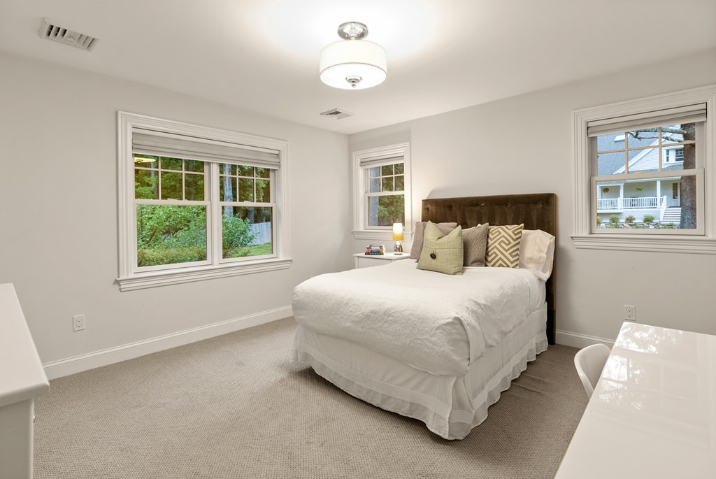 4 Fields Lane Wayland, MA 01778 - Photo 30 of 39 a bedroom with a bed and a window
