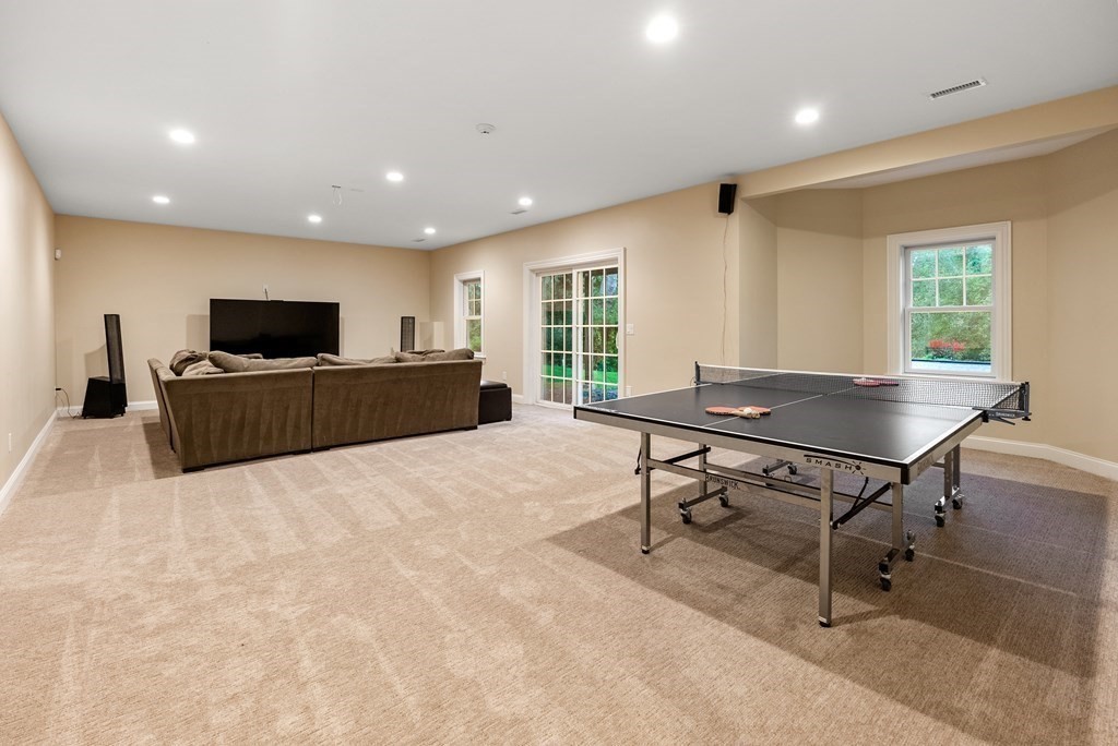 4 Fields Lane Wayland, MA 01778 - Photo 31 of 39 a living room with furniture a flat screen tv and large window