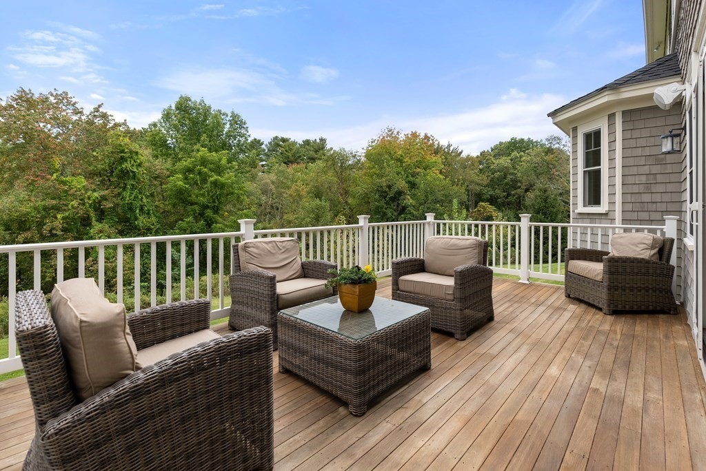 4 Fields Lane Wayland, MA 01778 - Photo 36 of 39 a view of a deck with furniture