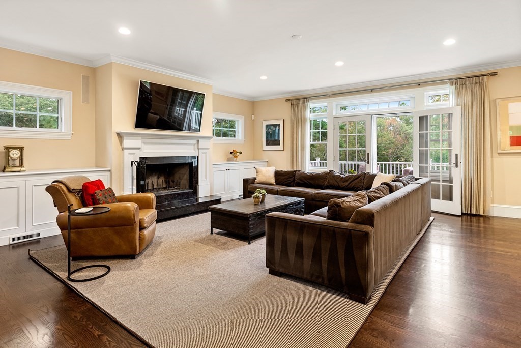 4 Fields Lane Wayland, MA 01778 - Photo 6 of 39 a living room with furniture flat screen tv and a fireplace