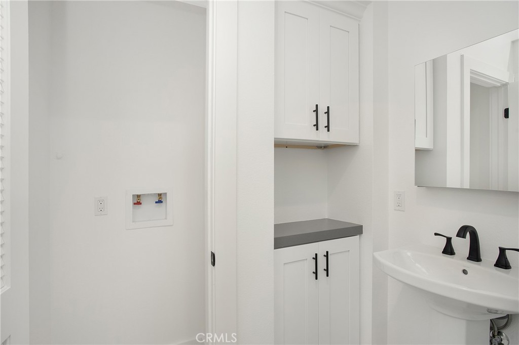 24216 Las Naranjas Drive, Unit B Laguna Niguel, CA 92677 - Photo 11 of 15 a bathroom with a sink and a vanity