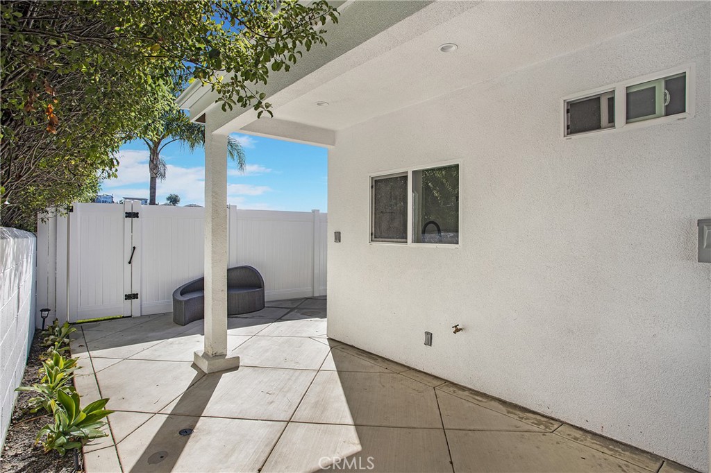 24216 Las Naranjas Drive, Unit B Laguna Niguel, CA 92677 - Photo 14 of 15 a backyard of a house with table and chair