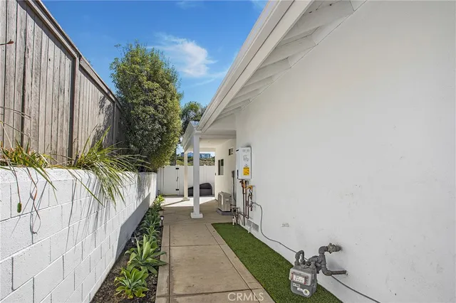 a view of a backyard with potted plants