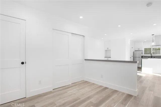 a view of kitchen with wooden floor
