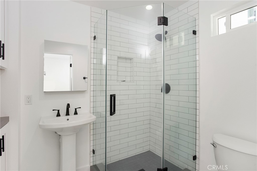 24216 Las Naranjas Drive, Unit B Laguna Niguel, CA 92677 - Photo 10 of 15 a bathroom with a sink a toilet and shower