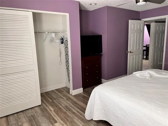 a bedroom with a bed and a dresser