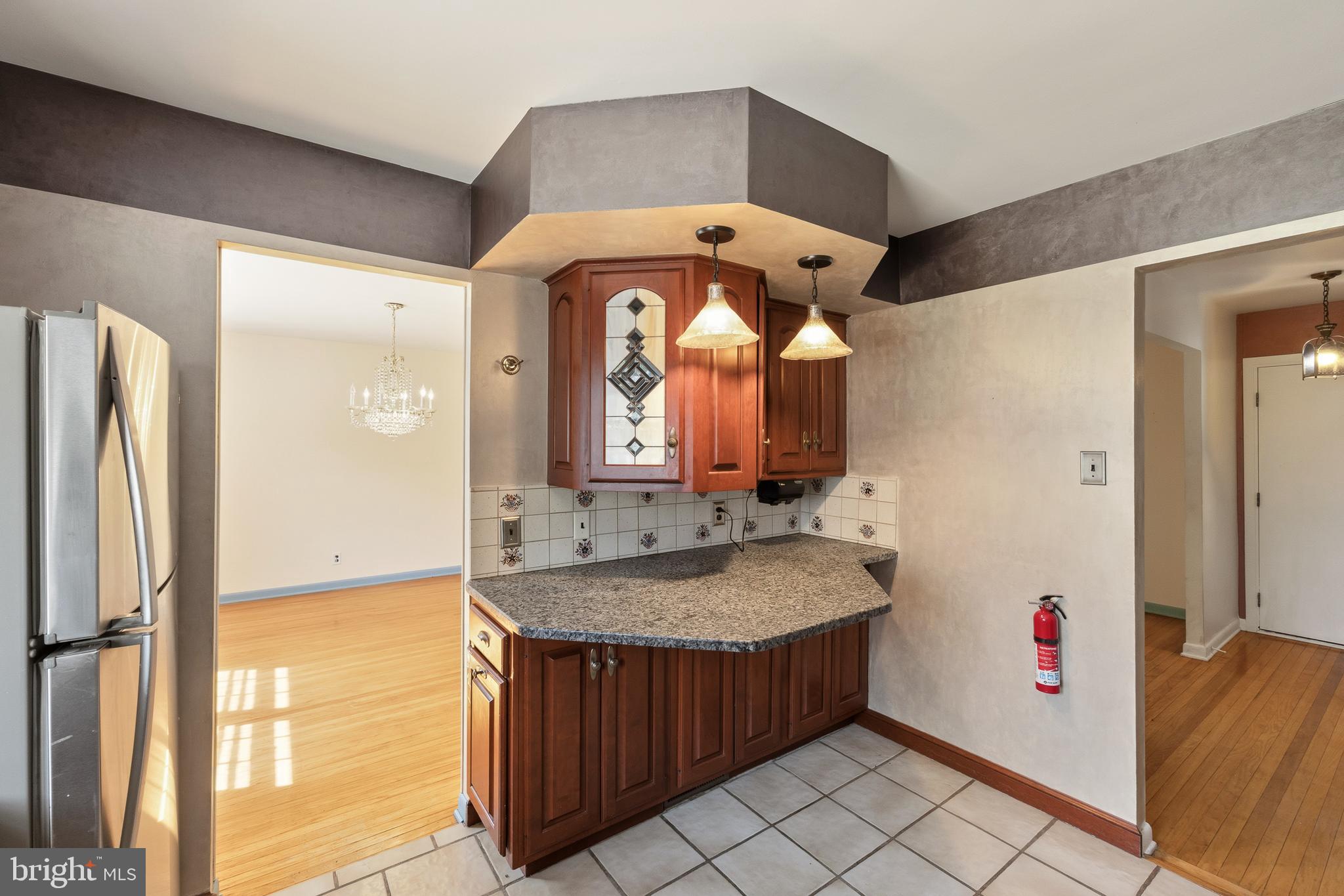 413 Columbia Avenue Pitman, NJ 08071 - Photo 13 of 33 a bathroom with a granite countertop sink and a mirror