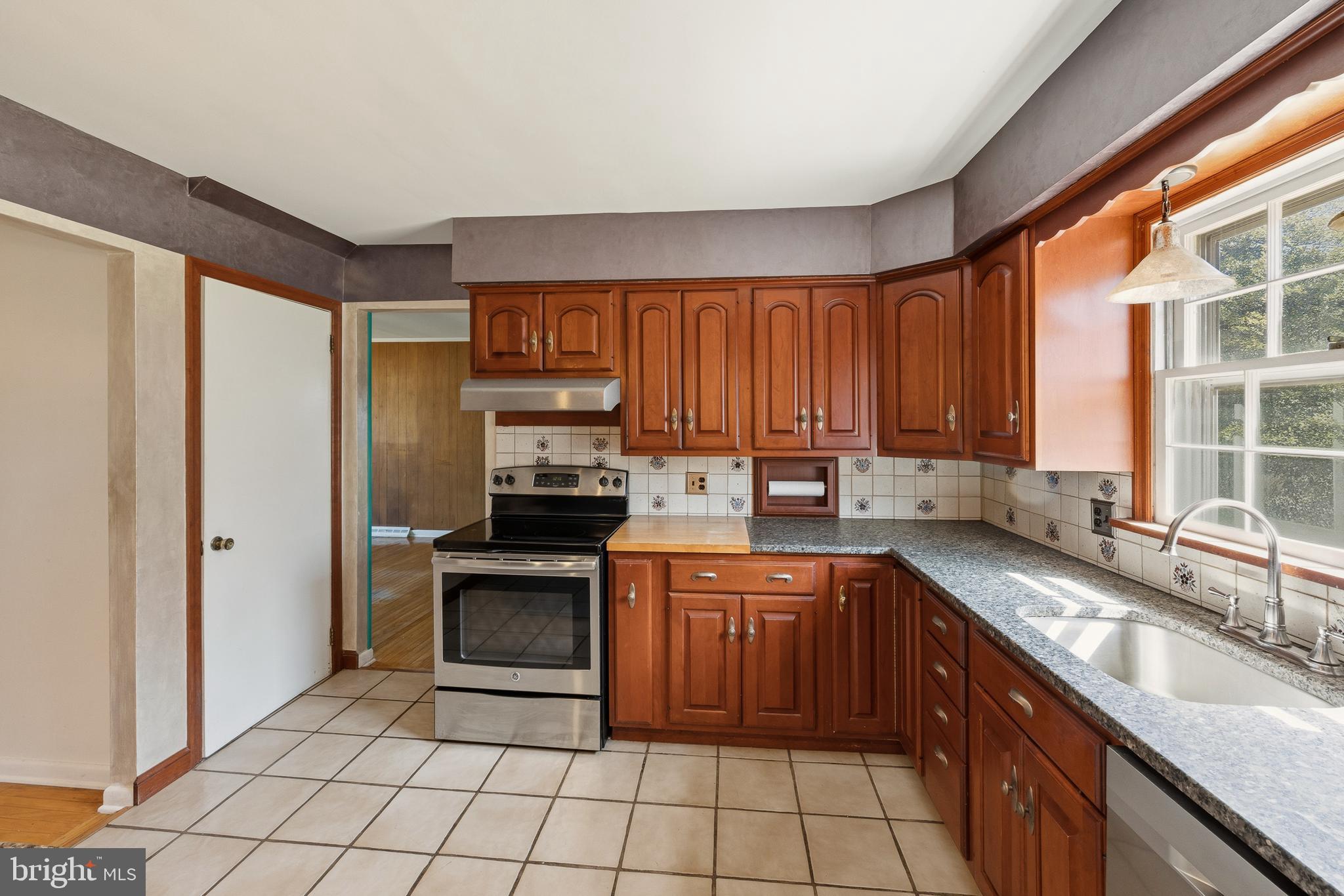 413 Columbia Avenue Pitman, NJ 08071 - Photo 14 of 33 a kitchen with a sink stove and cabinets