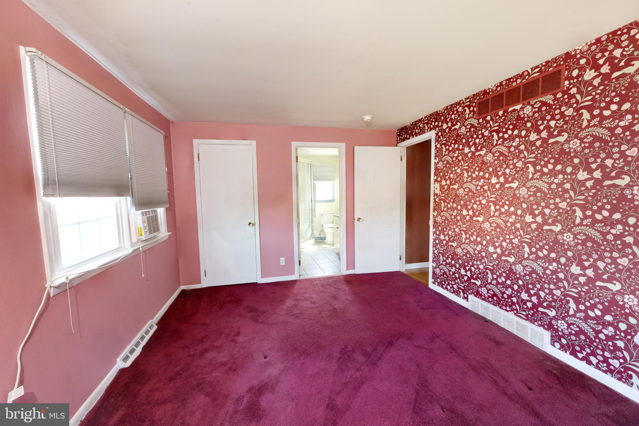 413 Columbia Avenue Pitman, NJ 08071 - Photo 21 of 33 a view of an empty room with window and wooden floor