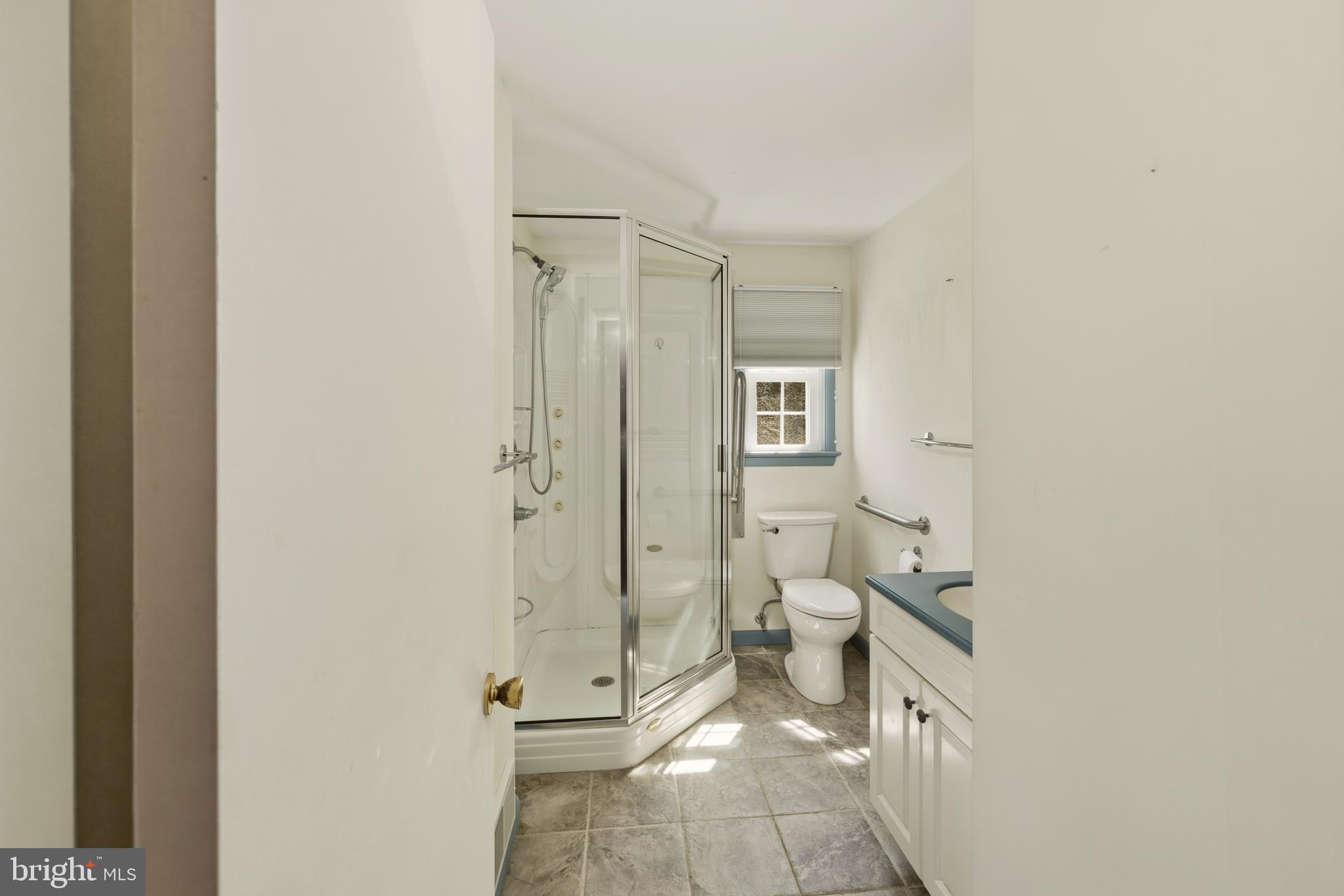 413 Columbia Avenue Pitman, NJ 08071 - Photo 22 of 33 a bathroom with a toilet a sink and shower