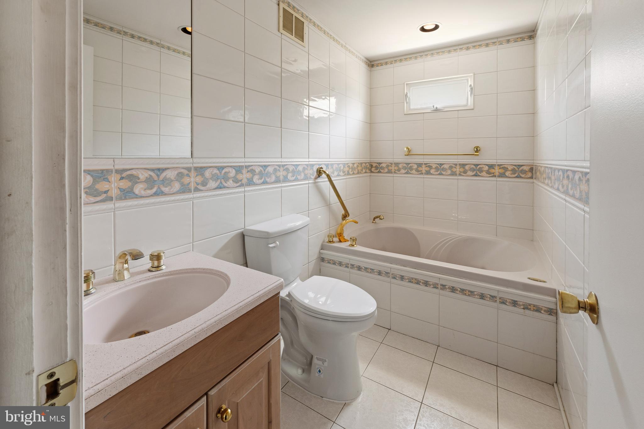 413 Columbia Avenue Pitman, NJ 08071 - Photo 24 of 33 a bathroom with a sink a toilet and shower