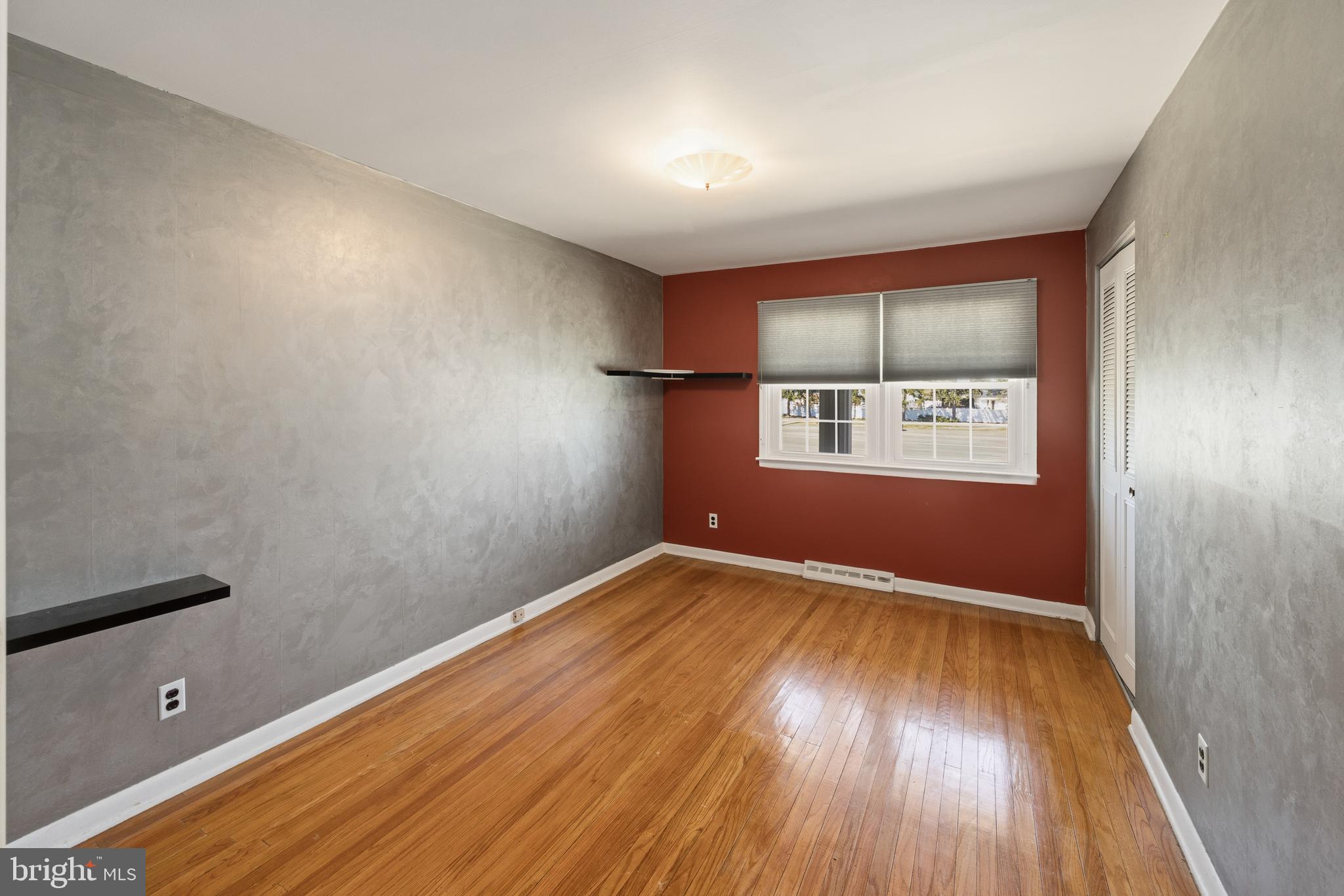 413 Columbia Avenue Pitman, NJ 08071 - Photo 25 of 33 a view of empty room with wooden floor and fan