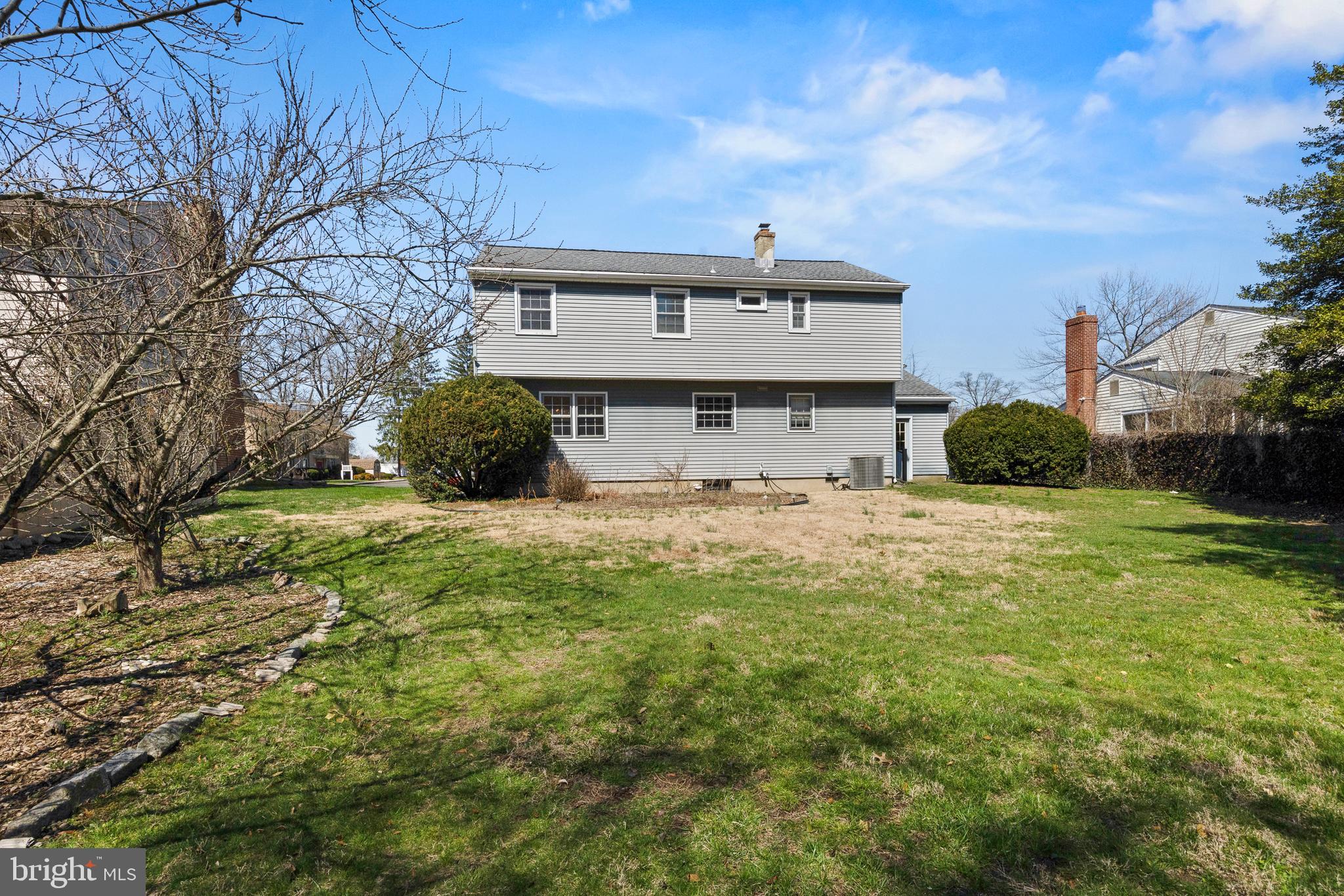413 Columbia Avenue Pitman, NJ 08071 - Photo 5 of 33 a front view of a house with a yard