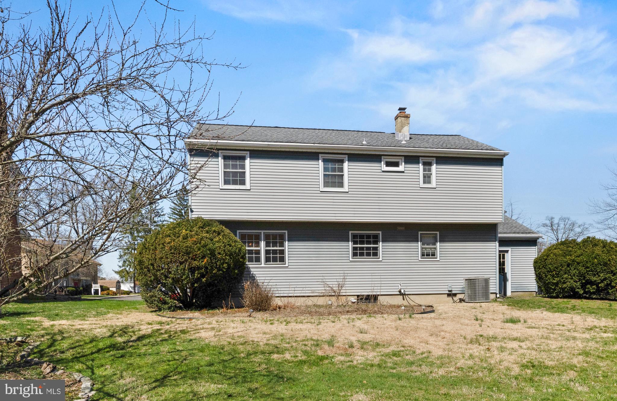 413 Columbia Avenue Pitman, NJ 08071 - Photo 6 of 33 a front view of a house with a yard