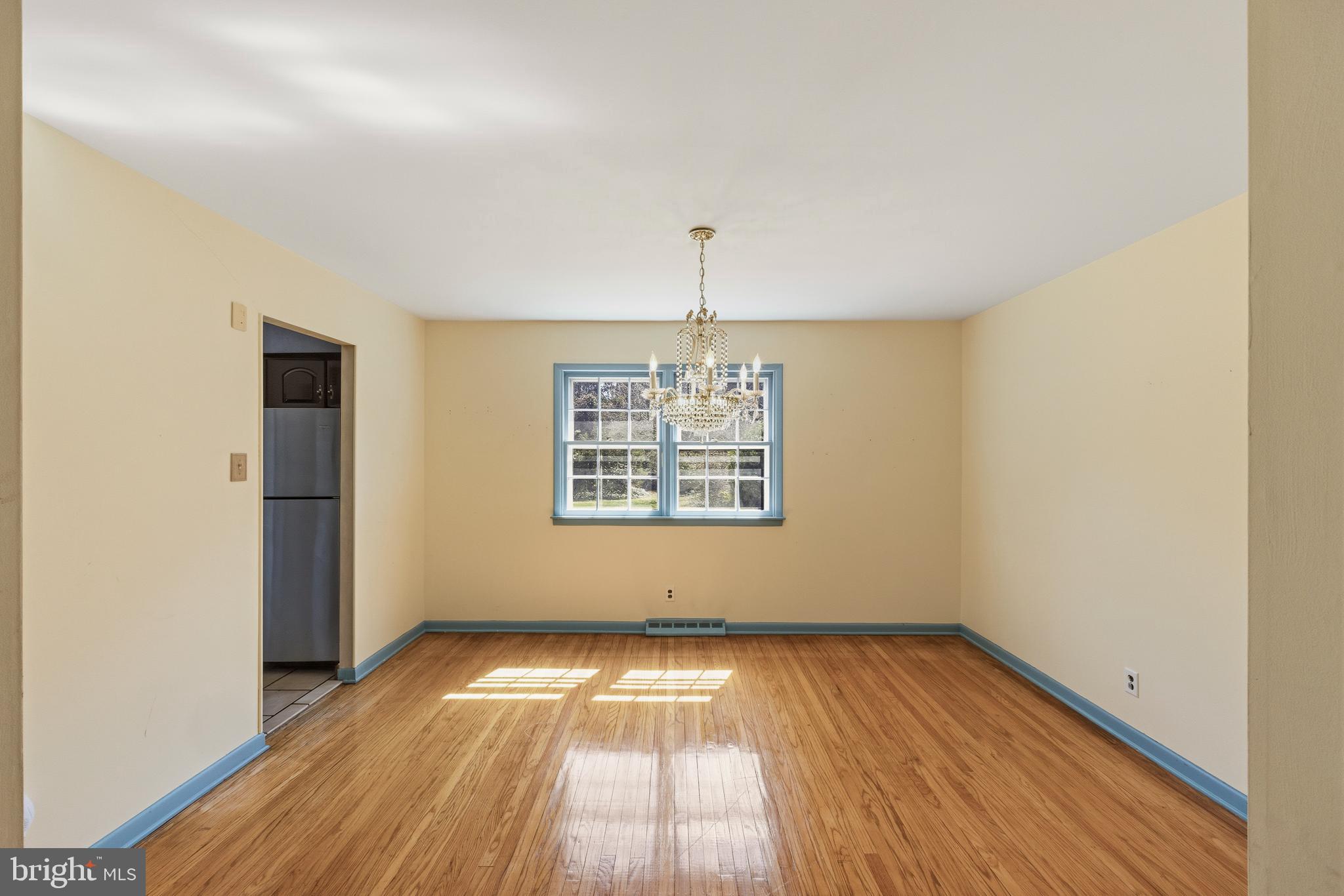 413 Columbia Avenue Pitman, NJ 08071 - Photo 10 of 33 a view of empty room with wooden floor and fan