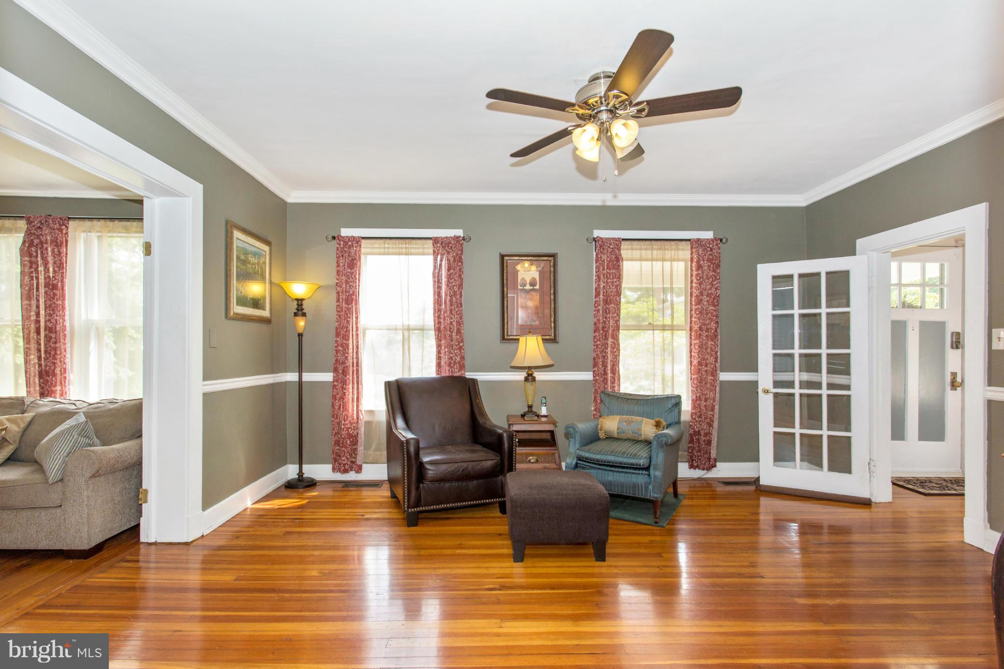 629 Aldershot Road Baltimore, MD 21229 - Photo 14 of 30 a living room with furniture window and wooden floor