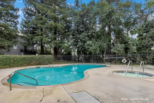 a view of a swimming pool with a backyard