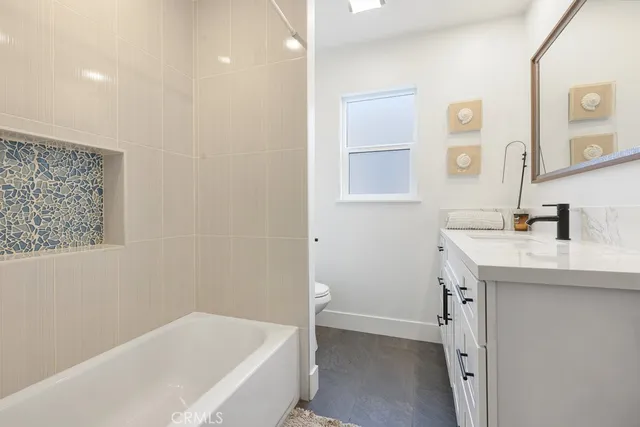 a bathroom with a bathtub and a sink