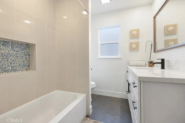 a bathroom with a bathtub and a sink