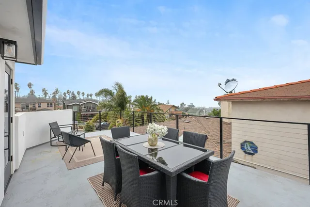 a terrace with a table and chairs