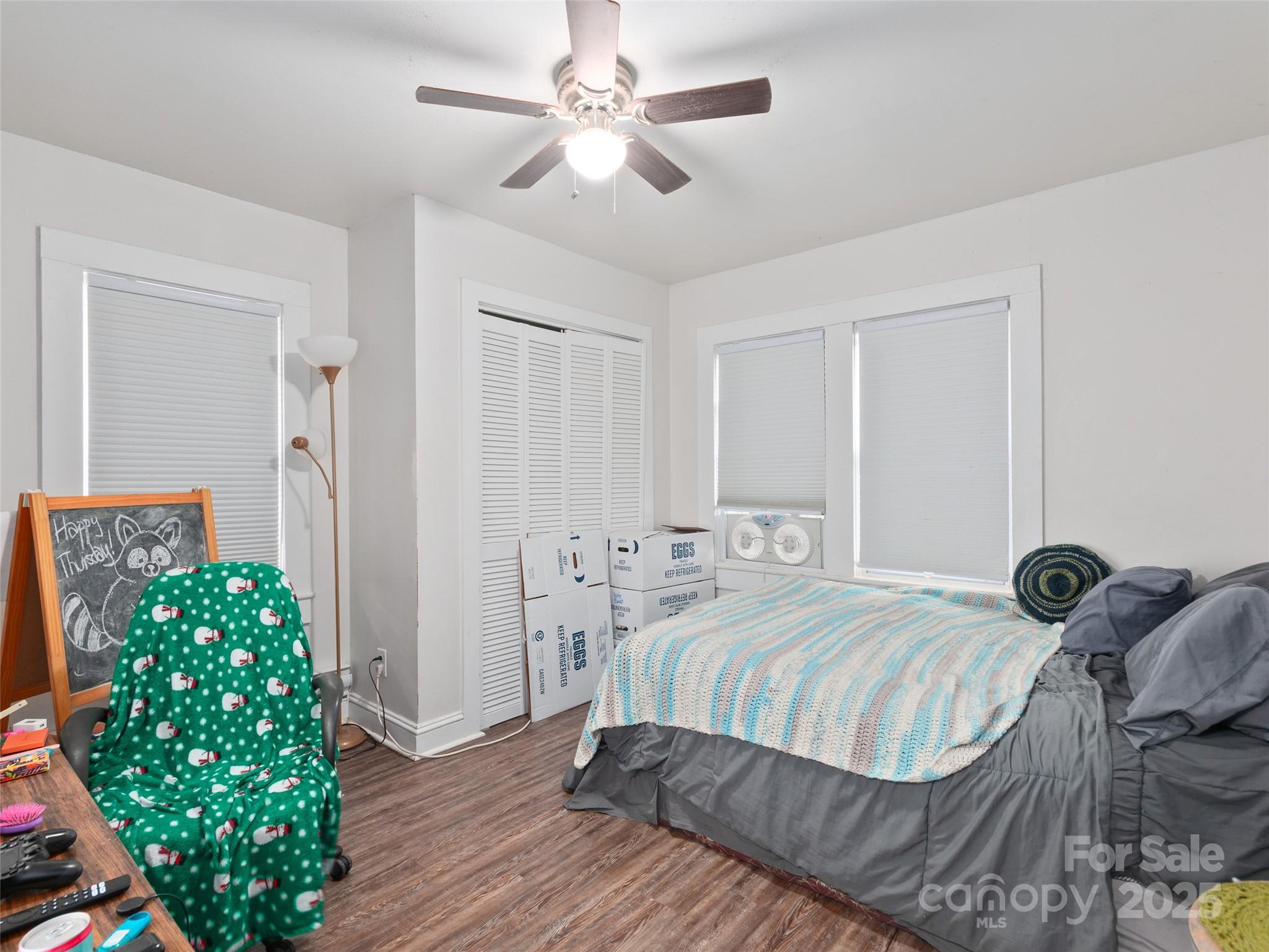 24 Timber Lane Waynesville, NC 28786 - Photo 5 of 13 a bedroom with a bed chandelier and a window