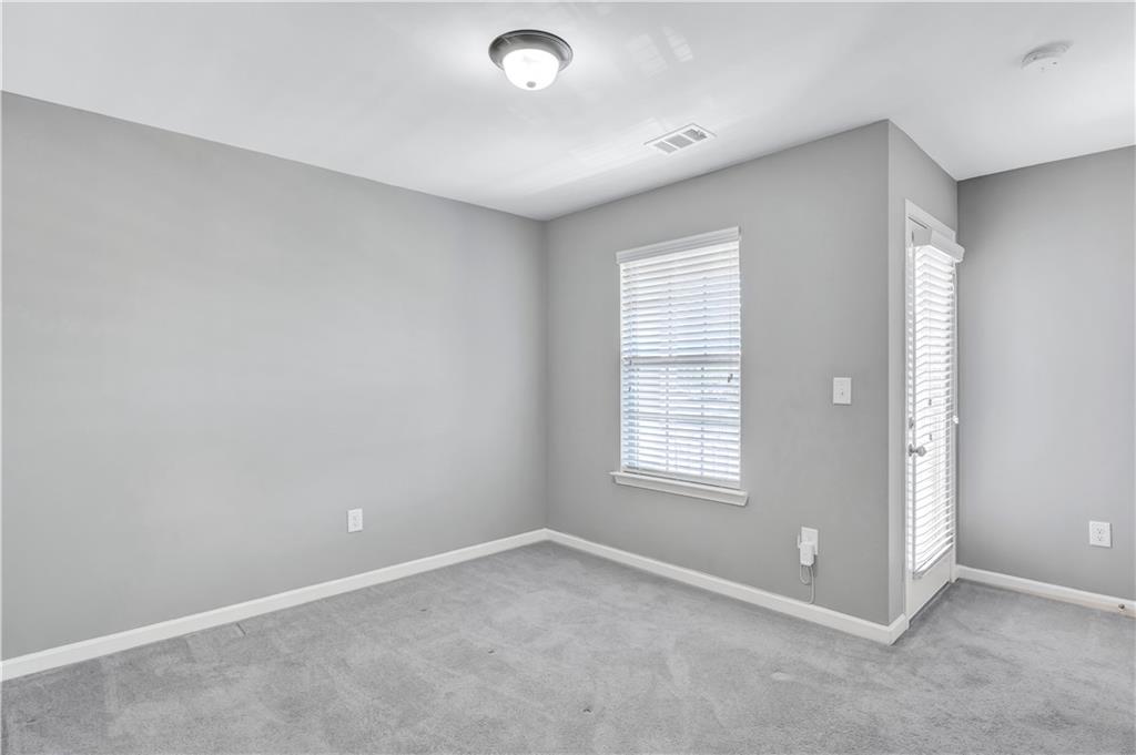 330 Avalon Square Fairburn, GA 30213 - Photo 31 of 52 an empty room with windows