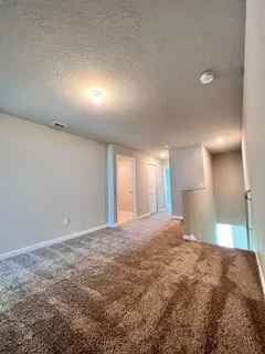 a view of a room next to a window