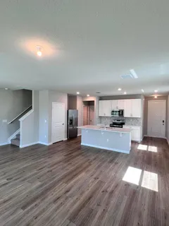 a view of kitchen with wooden floor