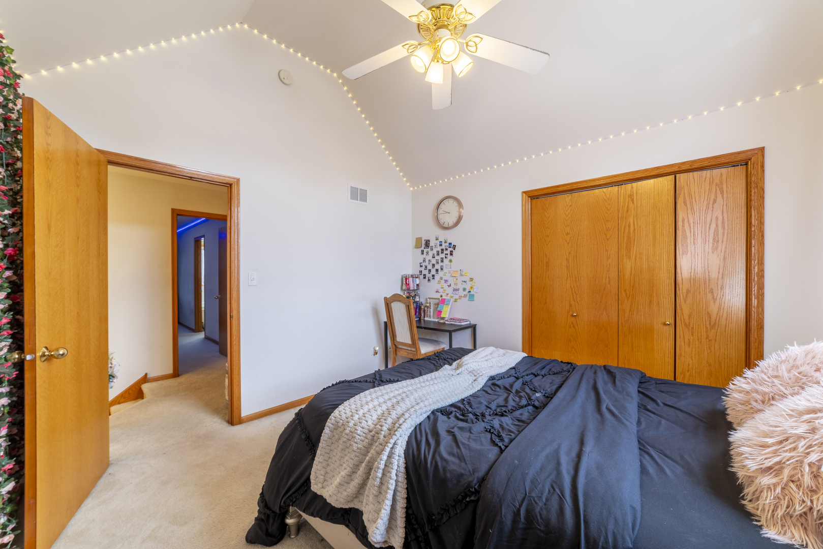 1071 Yamma Ridge New Lenox, IL 60451 - Photo 31 of 51 a bedroom with a bed and a chandelier
