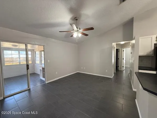 a view of an empty room with a window