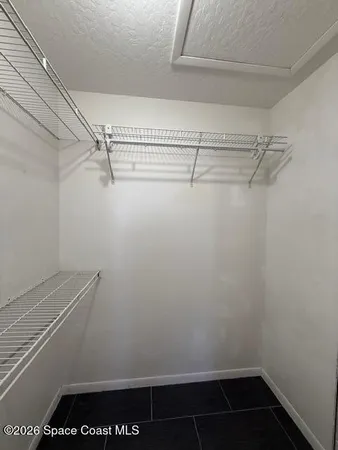 a view of a room with racks on the wall
