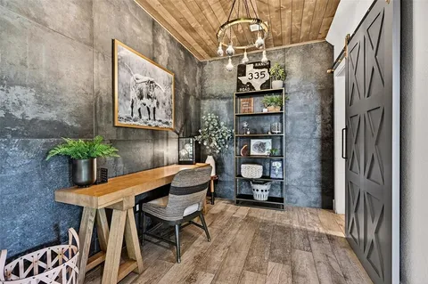 a dining room with furniture and wooden floor