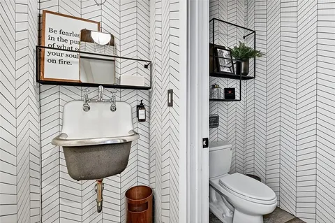 a bathroom with a toilet and a sink