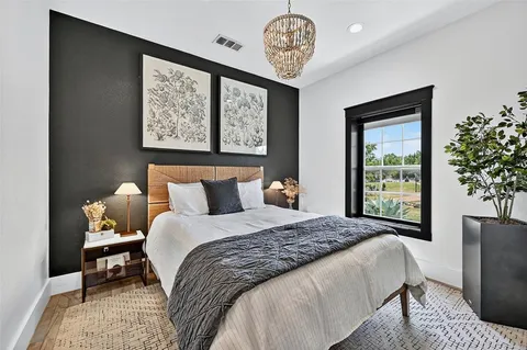 a bedroom with bed and a window