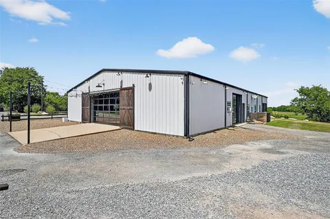 a living room with lots of furniture and a table