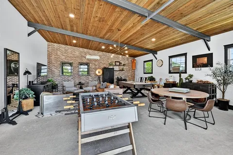 a bathroom with a toilet a sink and a shower curtain