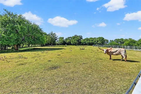 an aerial view of a house with a garden