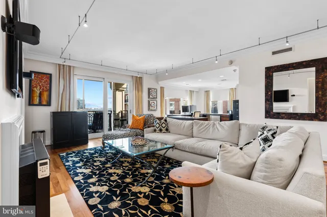 a living room with furniture or couch and a flat screen tv