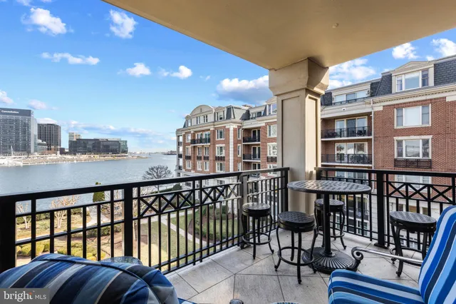 a view of a balcony with chairs