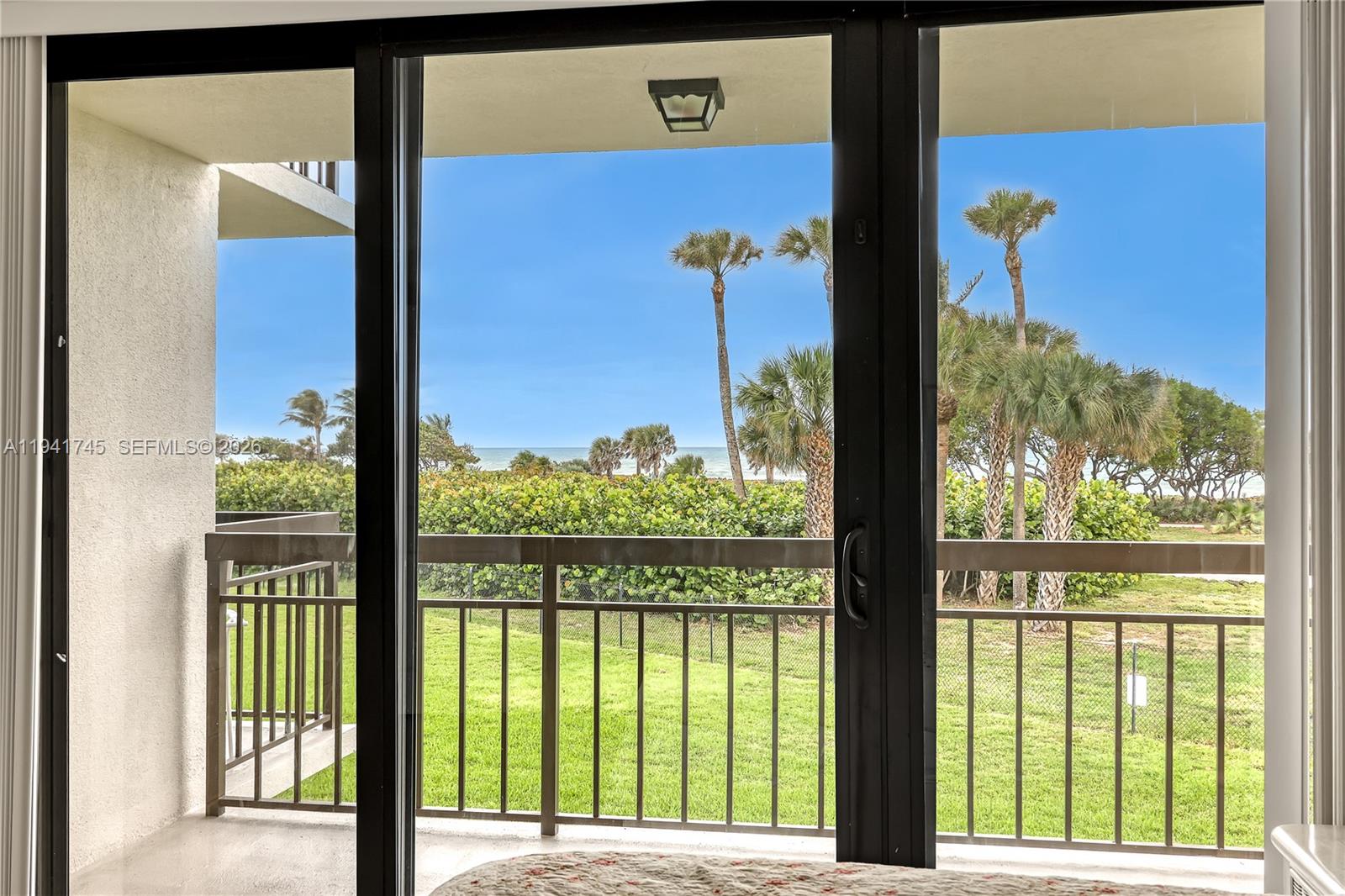 a view of a porch with a floor to ceiling window