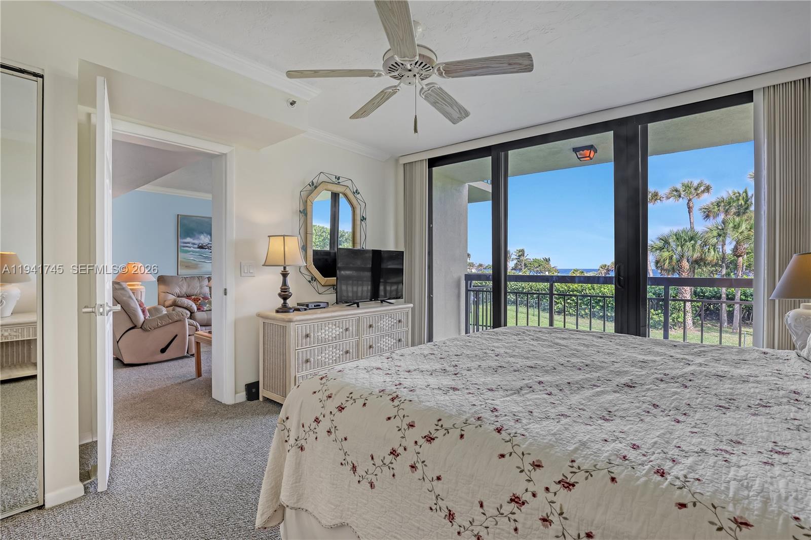 701 South Seas Drive, Unit 206 Jupiter, FL 33477 - Photo 12 of 19 a bed room with a bed and a large window