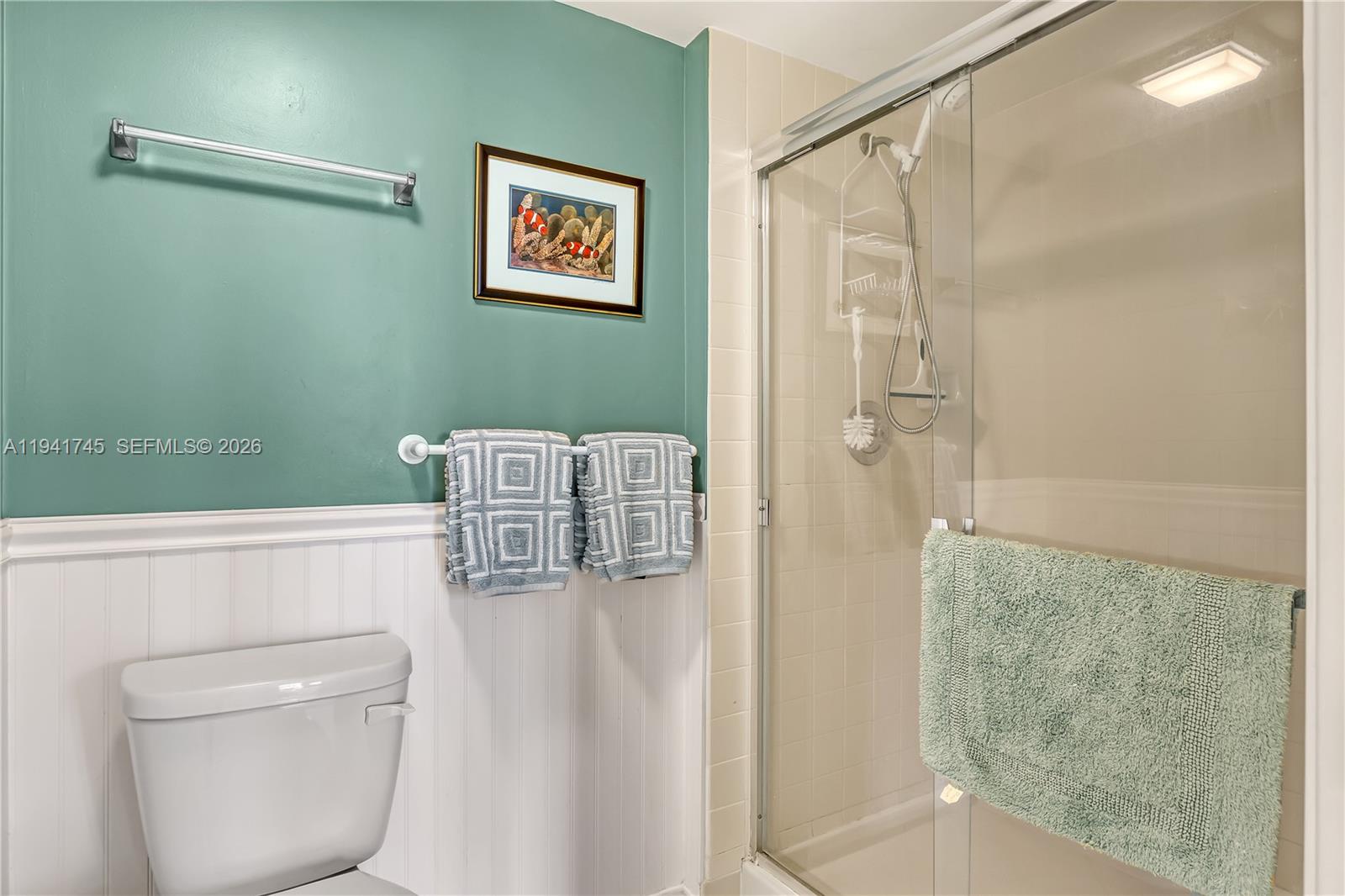 701 South Seas Drive, Unit 206 Jupiter, FL 33477 - Photo 15 of 19 a bathroom with a shower and a sink
