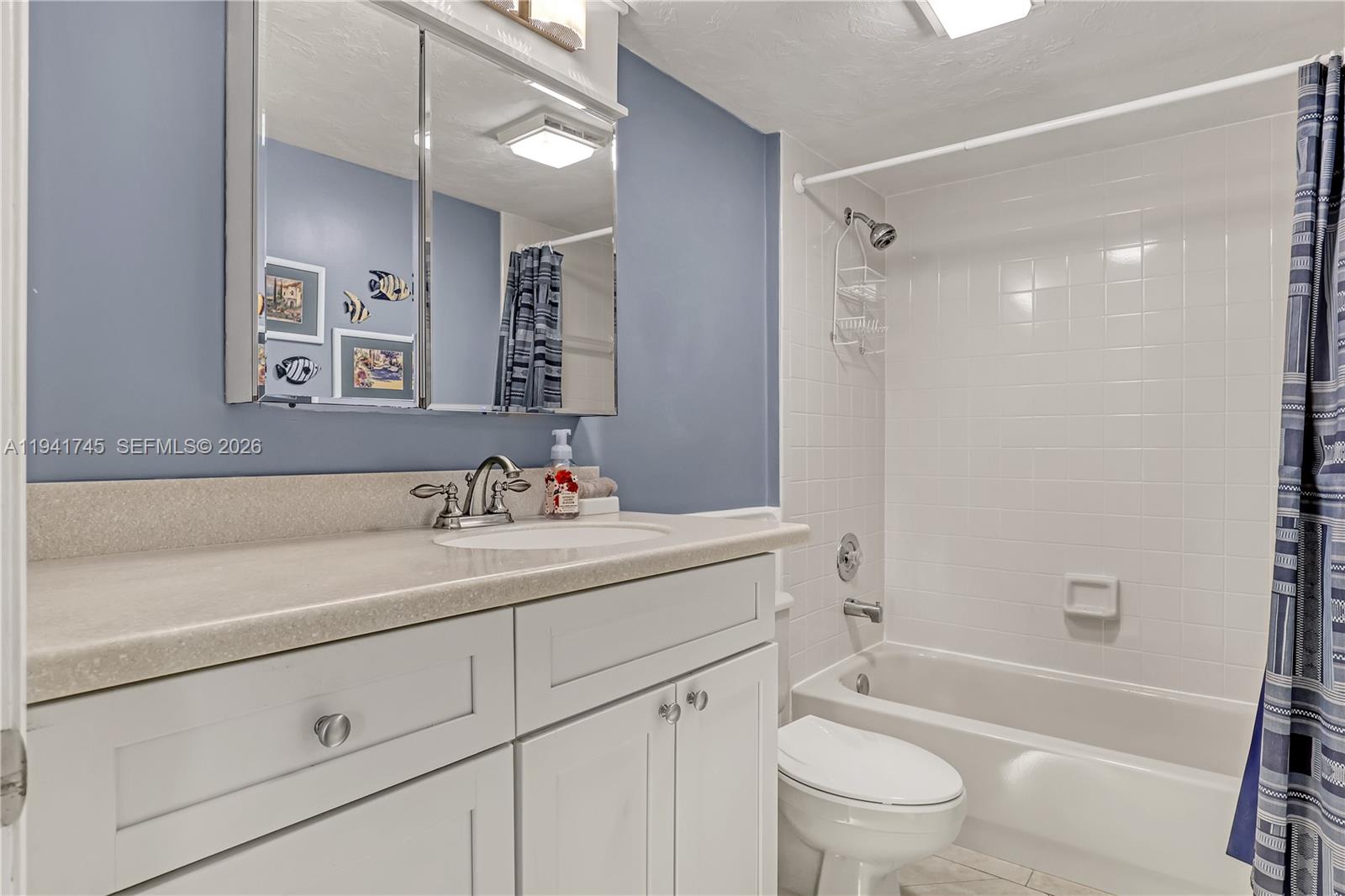 701 South Seas Drive, Unit 206 Jupiter, FL 33477 - Photo 17 of 19 a bathroom with a sink a toilet and a bathtub