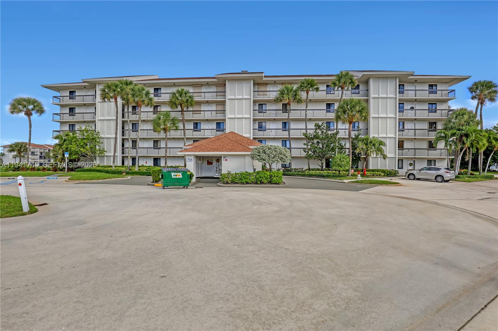 701 South Seas Drive, Unit 206 Jupiter, FL 33477 - Photo 2 of 19 a view of a building with a street