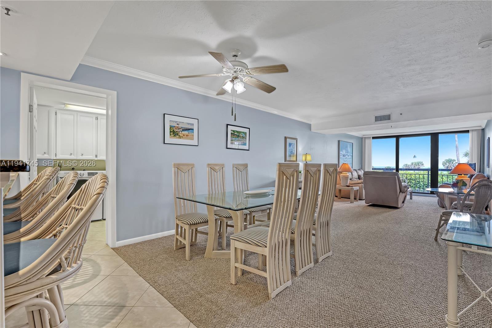 701 South Seas Drive, Unit 206 Jupiter, FL 33477 - Photo 3 of 19 a view of a livingroom with furniture and a ceiling fan