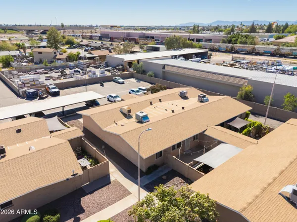 an aerial view of a residential apartment building with a yard